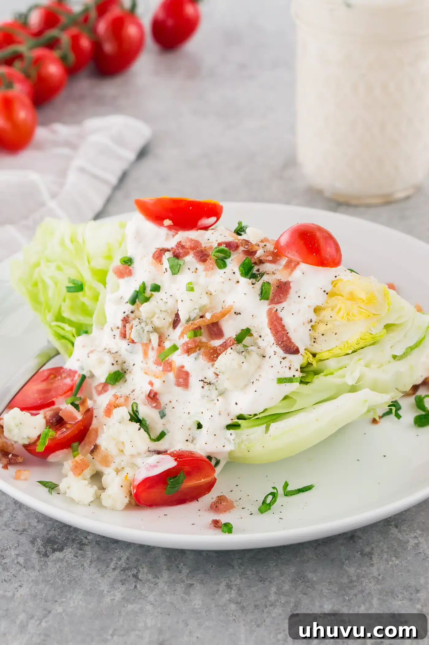 Tangy Blue Cheese Dressing 6 Blue cheese dressing generously drizzled over a crisp wedge salad