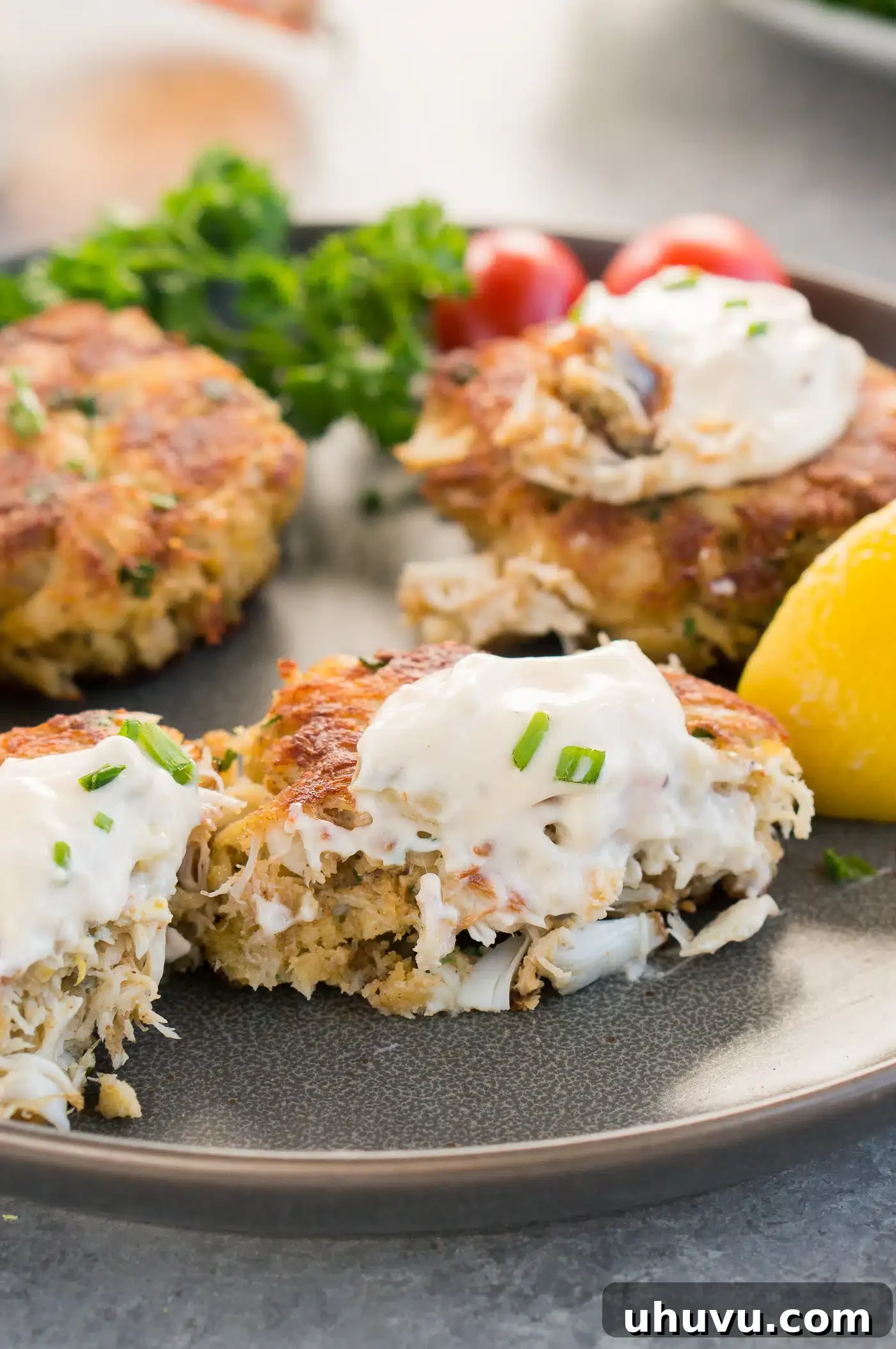 Golden Crab Delights 7 tartar sauce on cakes made with lump crab meat
