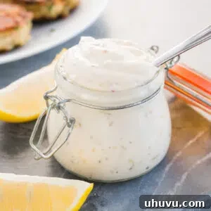 Homemade tartar sauce in a small bowl with fresh herbs.