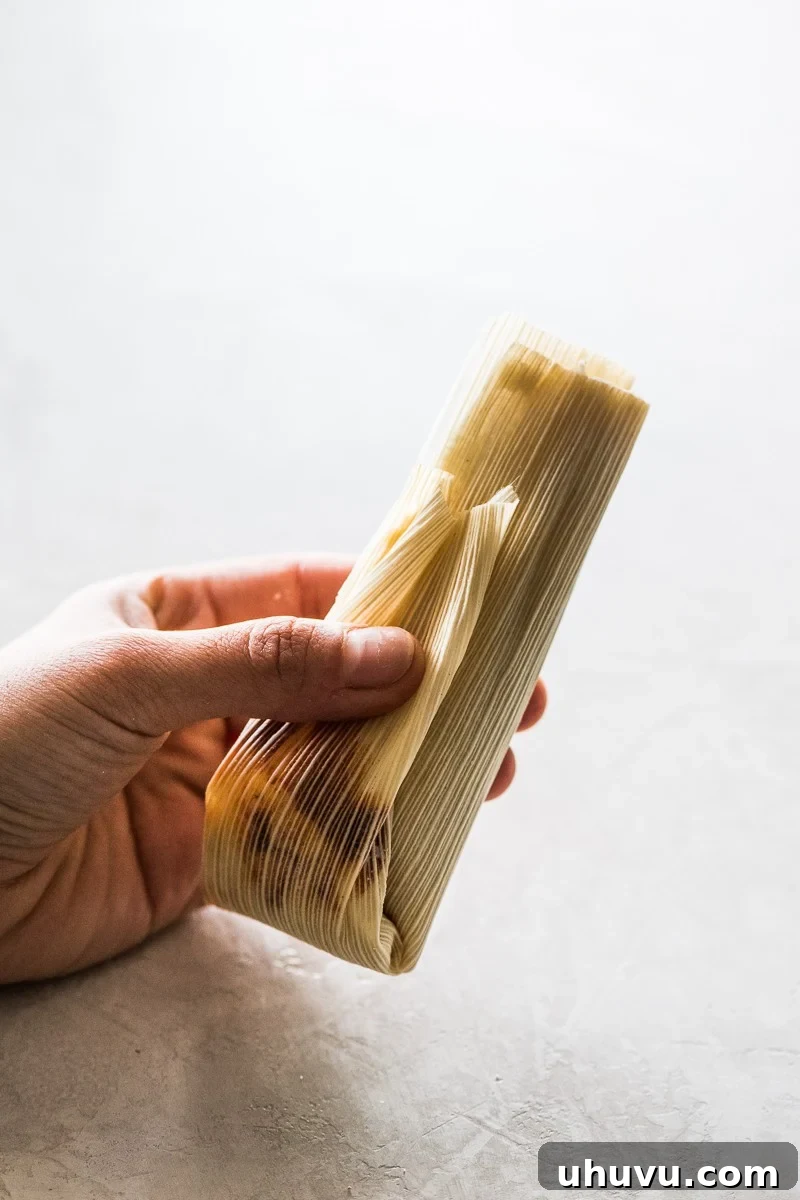 Unwrap the Flavor: Authentic Mexican Tamales 15 A perfectly folded tamal, ready to be placed in the steamer.
