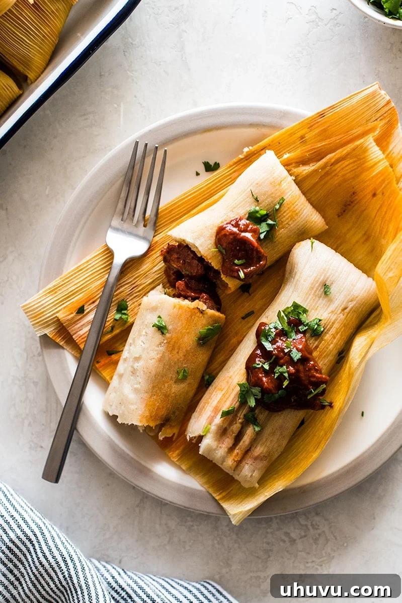 Unwrap the Flavor: Authentic Mexican Tamales 17 Perfectly cooked tamales on a plate with the corn husks removed, ready to be enjoyed.