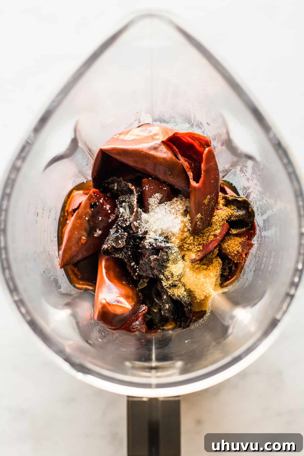 Unwrap the Flavor: Authentic Mexican Tamales 6 Softened red chiles and seasonings ready in a blender for the tamale sauce.