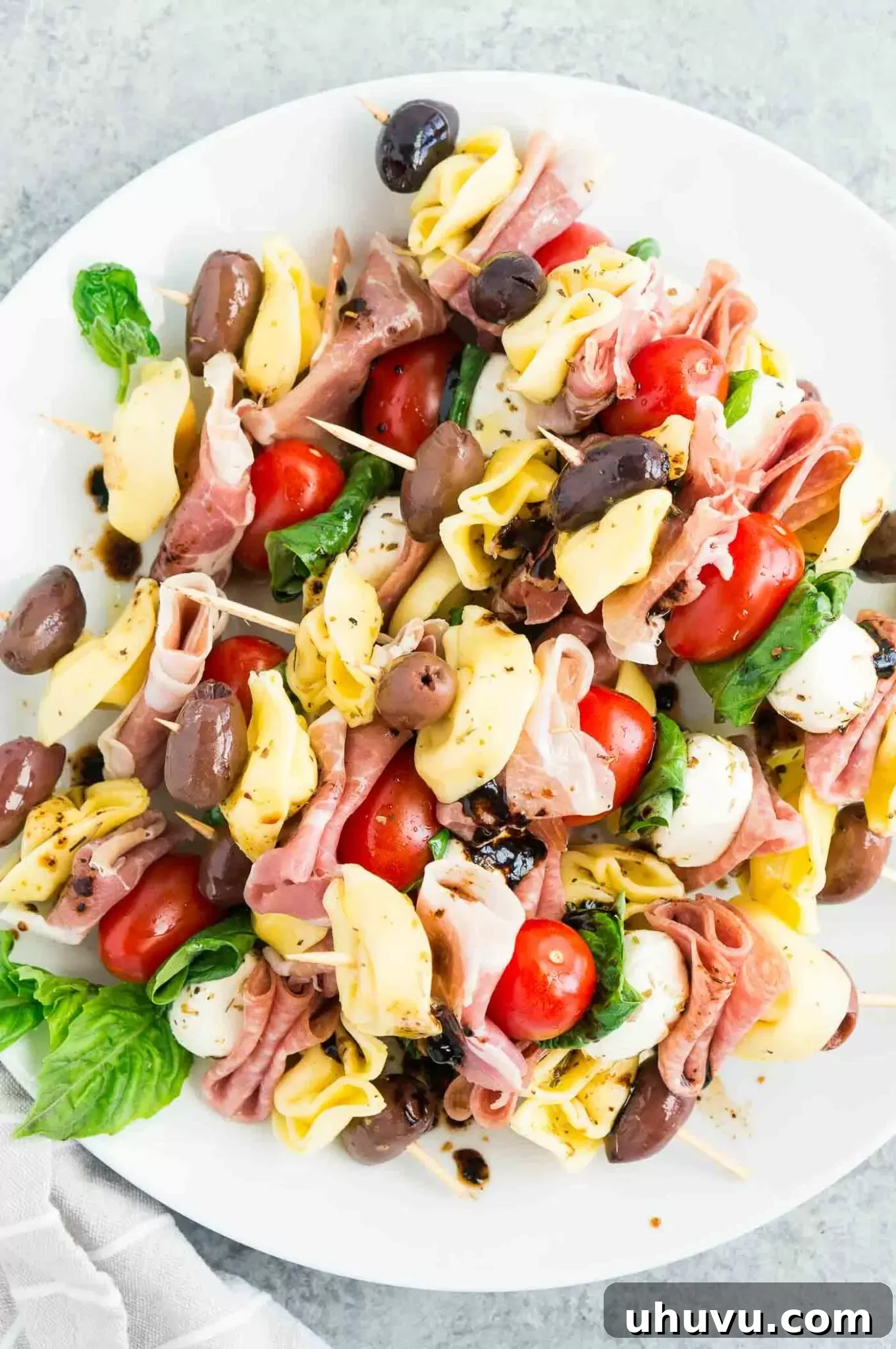 close up image of antipasto skewers on a platter