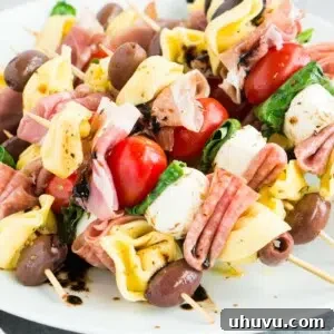 antipasto skewers on a white plate