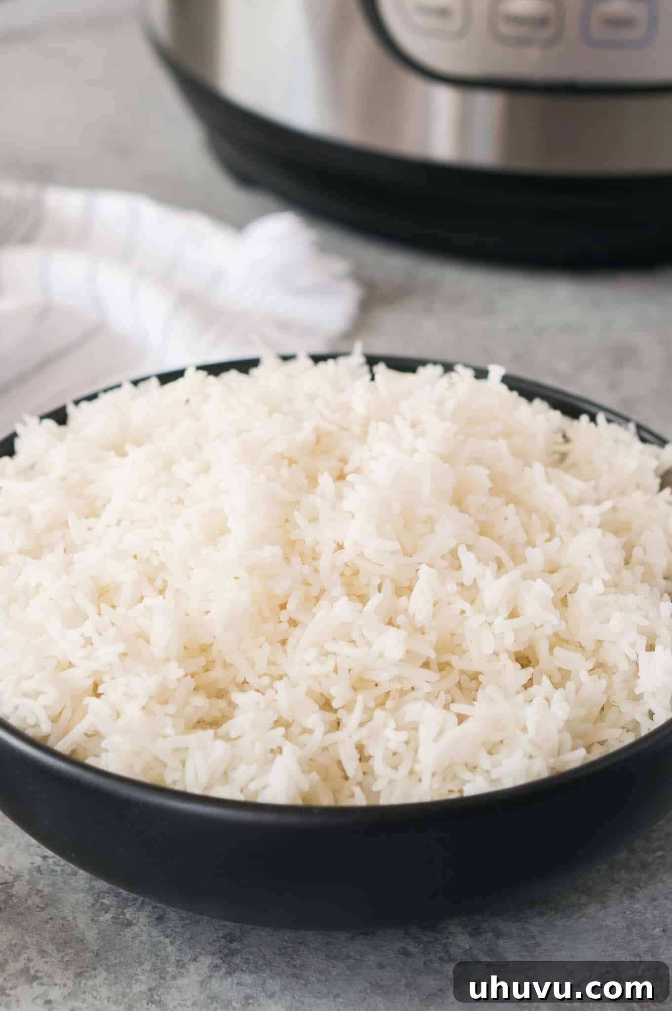 Pressure Cooker Rice Perfection 6 cooked rice in the pressure cooker served in a bowl