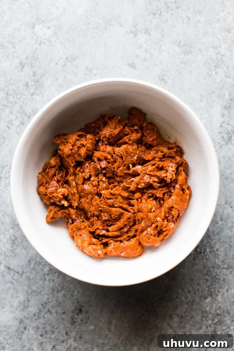 Chorizo Uncovered A Deep Dive into the Spicy Sausage 4 Raw Mexican chorizo removed from its casing and placed in a ceramic bowl.