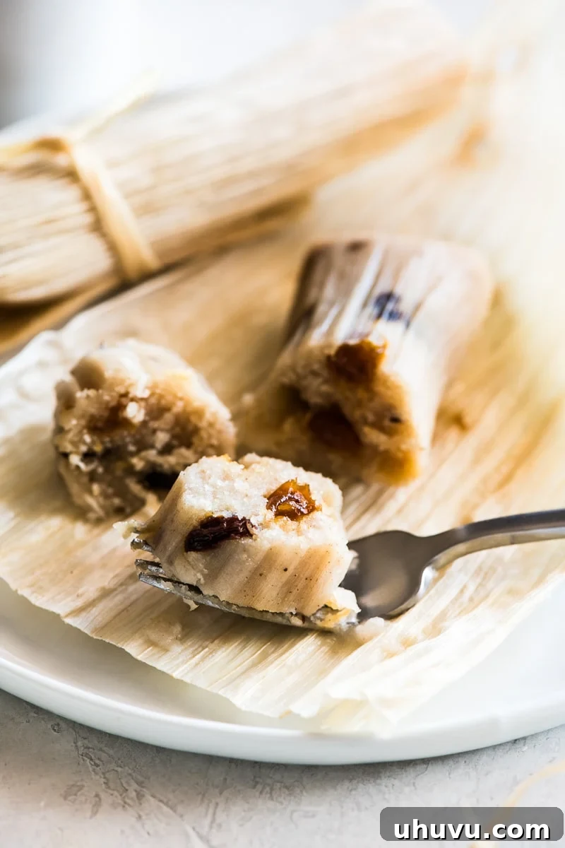 Sweet Corn Delights 6 A slice of sweet raisin tamales on a fork.