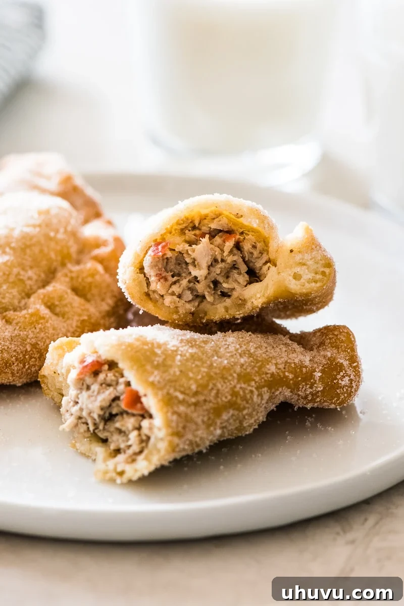 Easy Homemade Empanadas 7 A cross-section of a perfectly fried empanada revealing the savory pork and vegetable filling