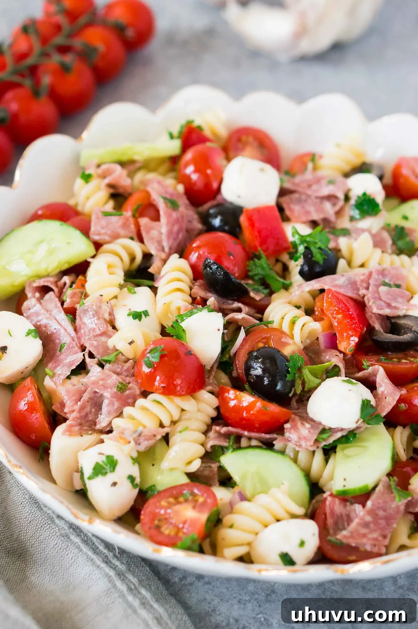 Vibrant Italian Pasta Salad 4 Close-up shot of a large bowl filled with healthy and colorful Italian pasta salad, featuring distinct ingredients.