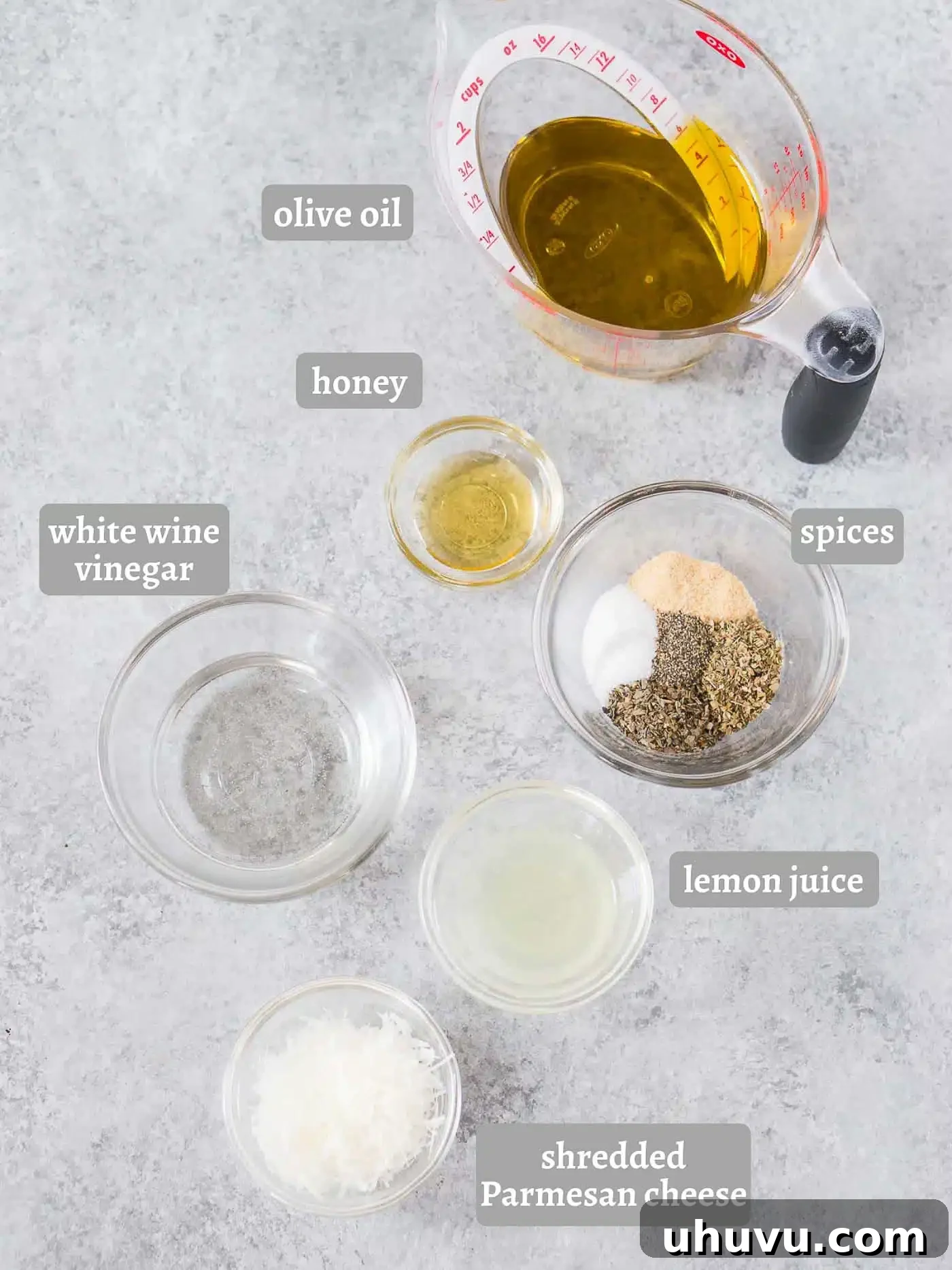 ingredients for Italian dressing on a wooden board
