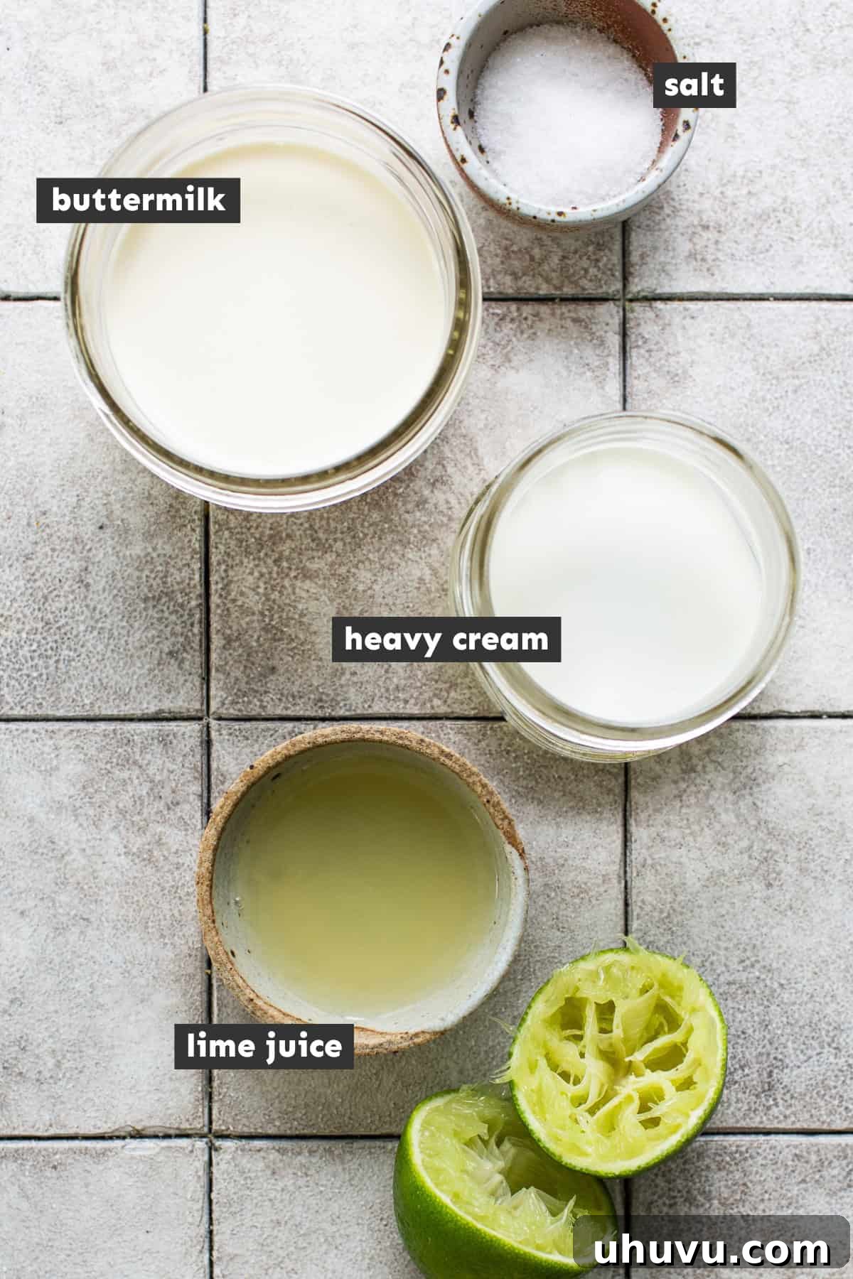 Mexico's Creamy Secret 3 The four simple ingredients for Mexican crema laid out on a table: heavy cream, buttermilk, limes, and salt.