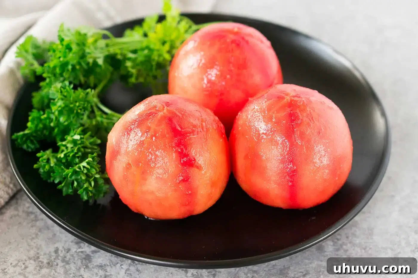 Flawless Tomato Peeling Made Simple 5 Close-up of freshly peeled tomatoes on a white plate