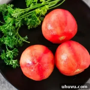 Peeled tomatoes on a plate, ready to be used in recipes