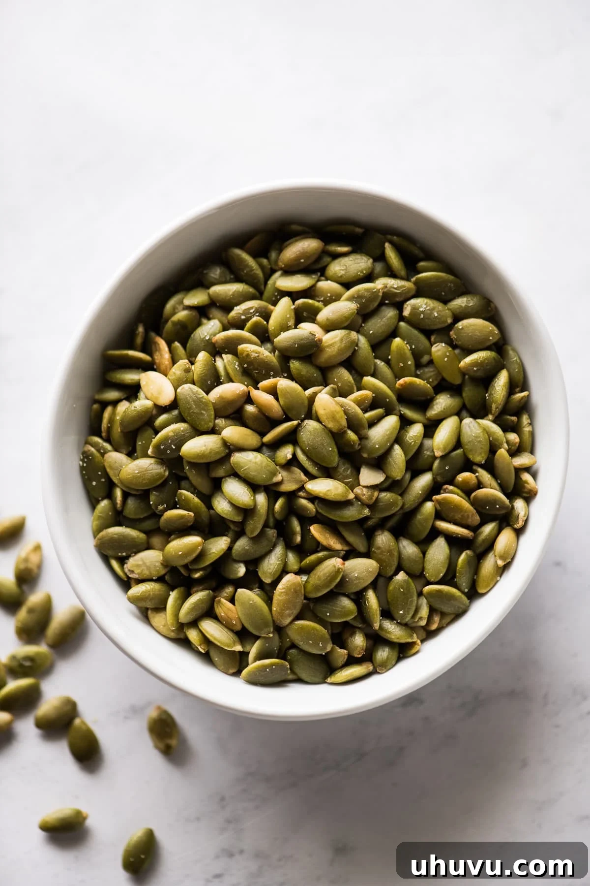 Pepitas (roasted pumpkin seeds) in a small bowl.