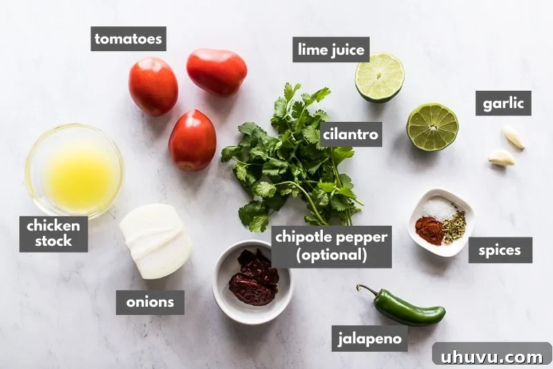 Zesty Ranchero Sauce 3 Fresh ingredients for ranchero sauce laid out on a wooden table.