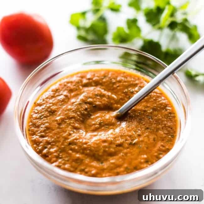 A bowl of vibrant, homemade ranchero sauce.