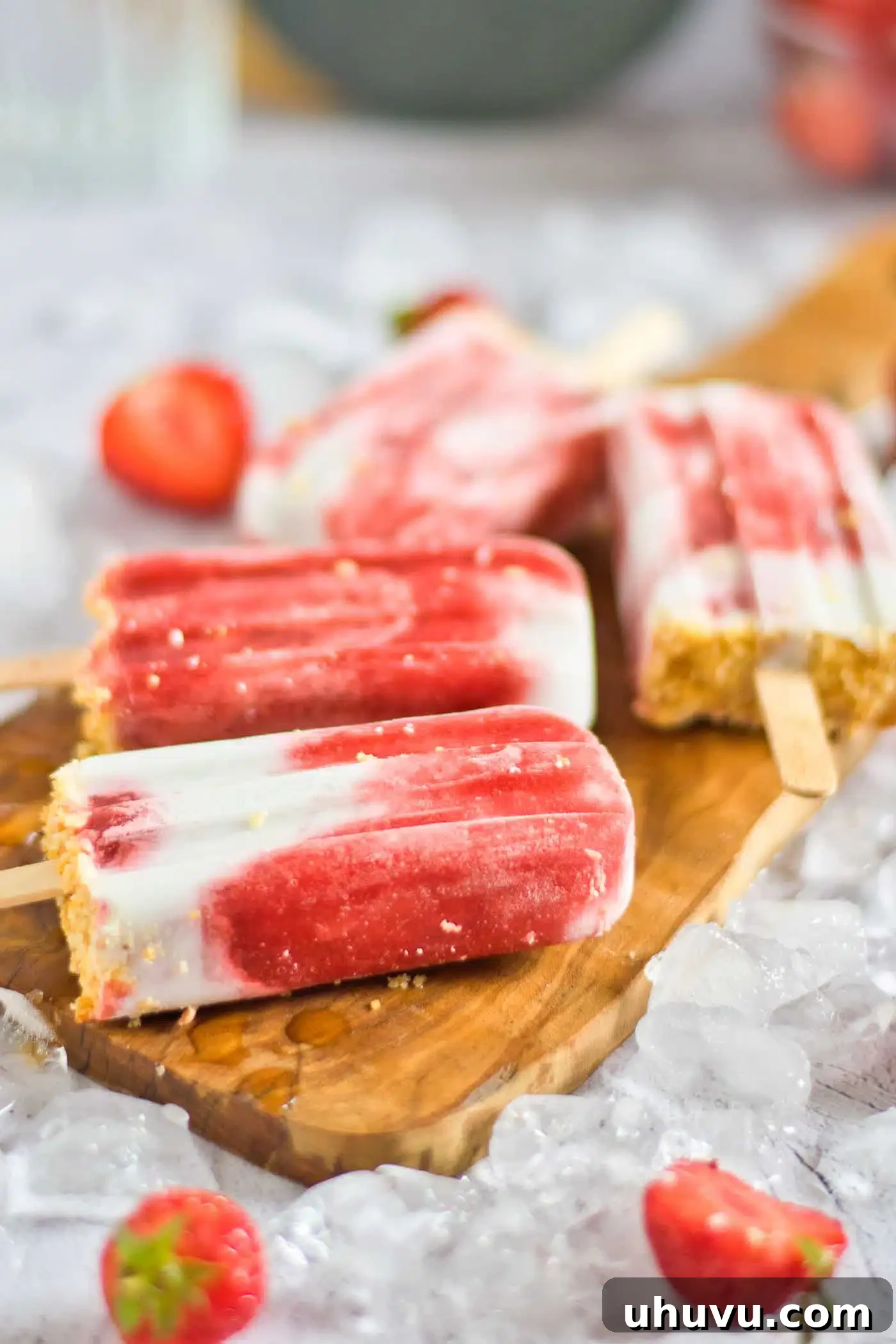 Frozen Strawberry Sunshine 8 popsicles on a board