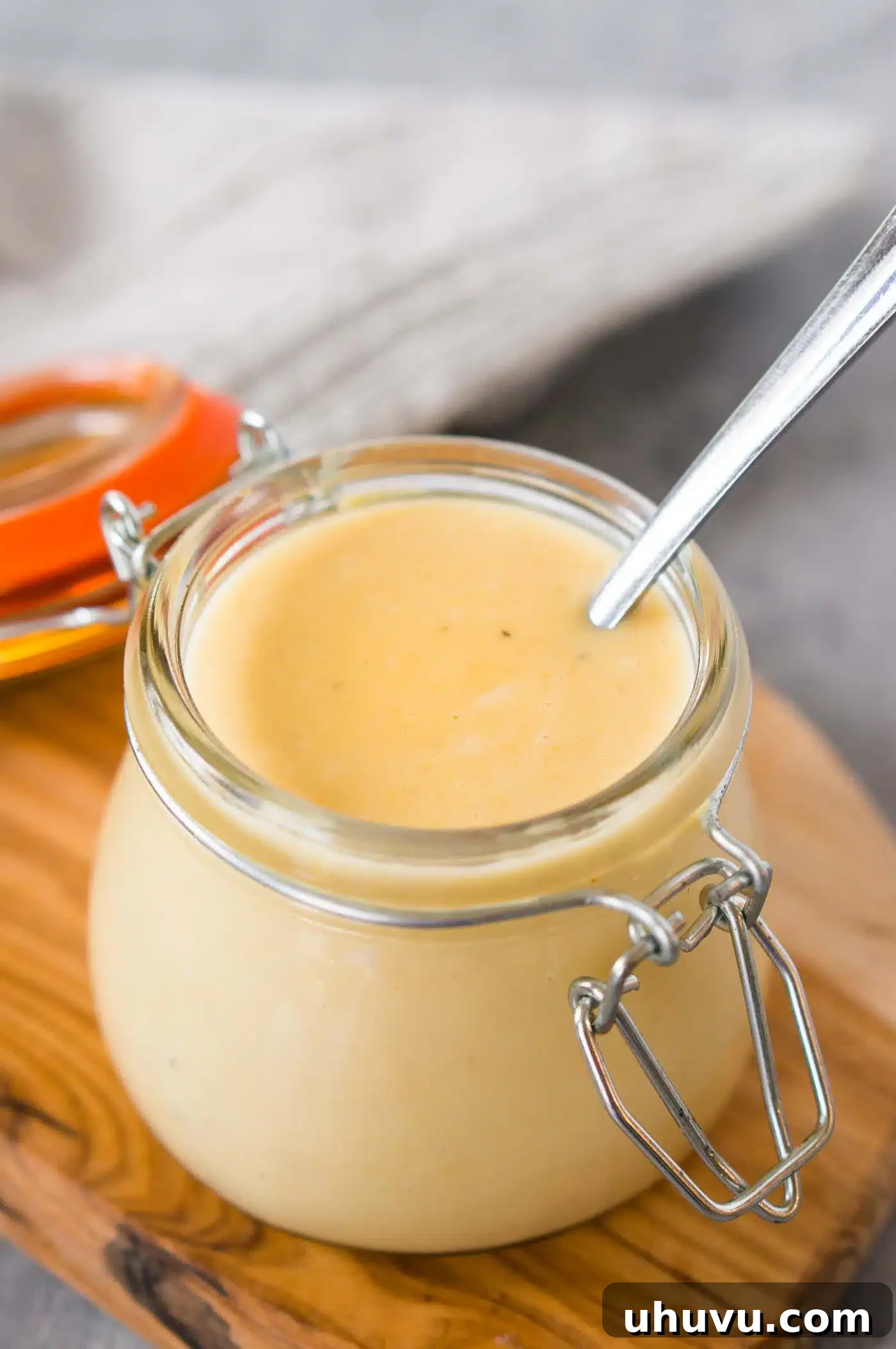 Honey Kissed Zing 2 homemade honey mustard sauce in a jar, ready to serve