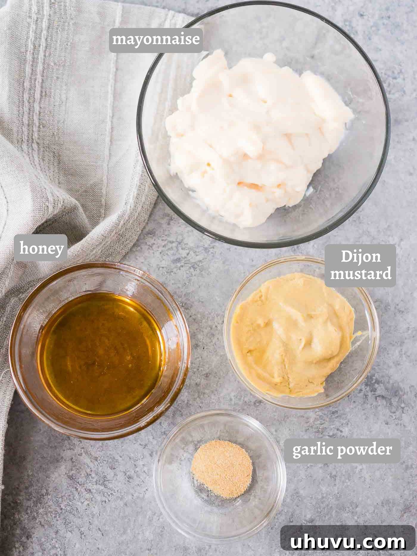 Honey Kissed Zing 4 ingredients for honey mustard sauce laid out on a table