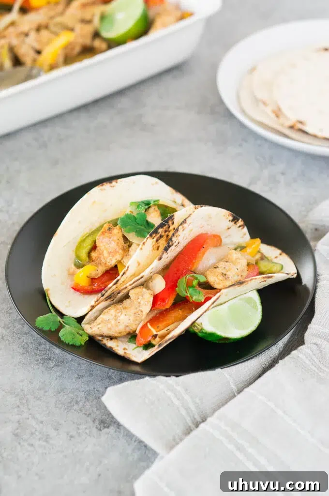 chicken fajitas on a tortilla with lime