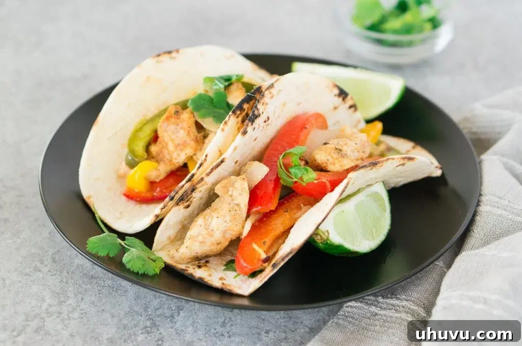baked fajitas on tortilla on a plate