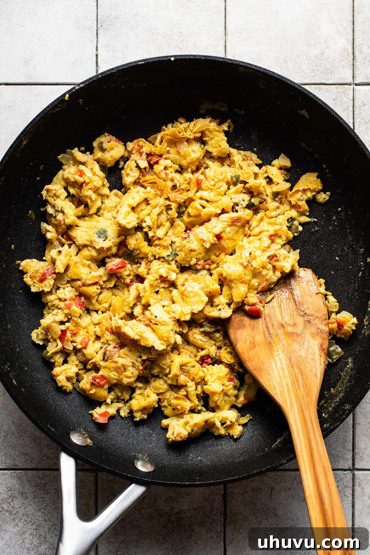 Savory Morning Quesadillas 4 A skillet filled with freshly cooked scrambled eggs mixed with tender sautéed peppers and onions.