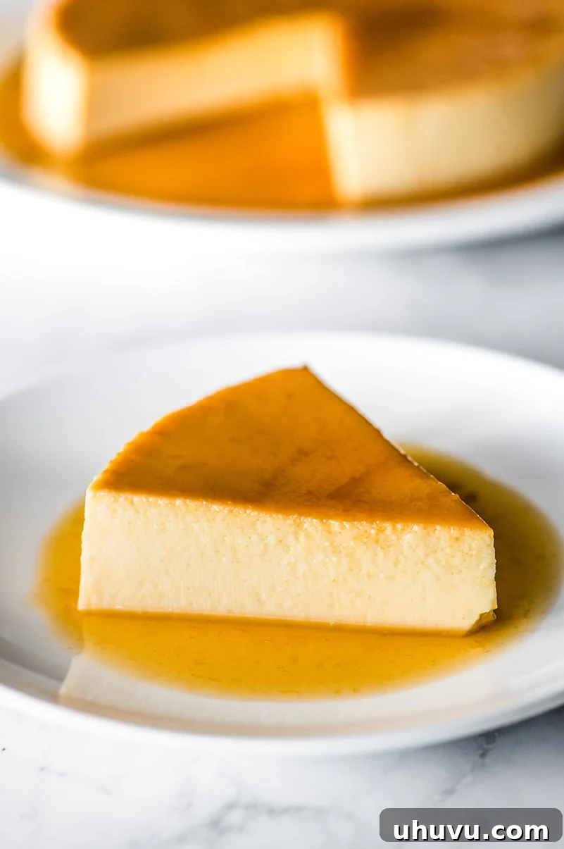 Simple Silky Flan Perfection 8 A delectable slice of flan adorned with a generous drizzle of its rich caramel sauce, inviting dessert lovers.