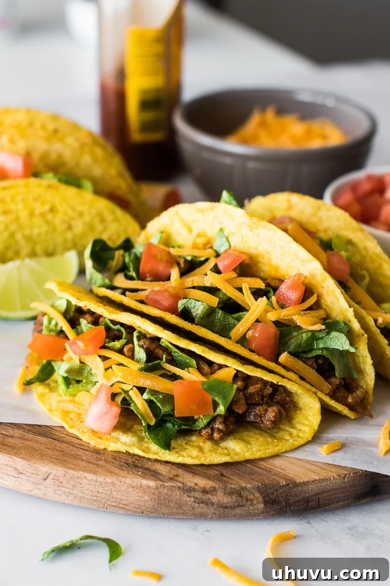 Golden Crispy Tacos 4 Hard shell tacos filled with ground beef and cheese.