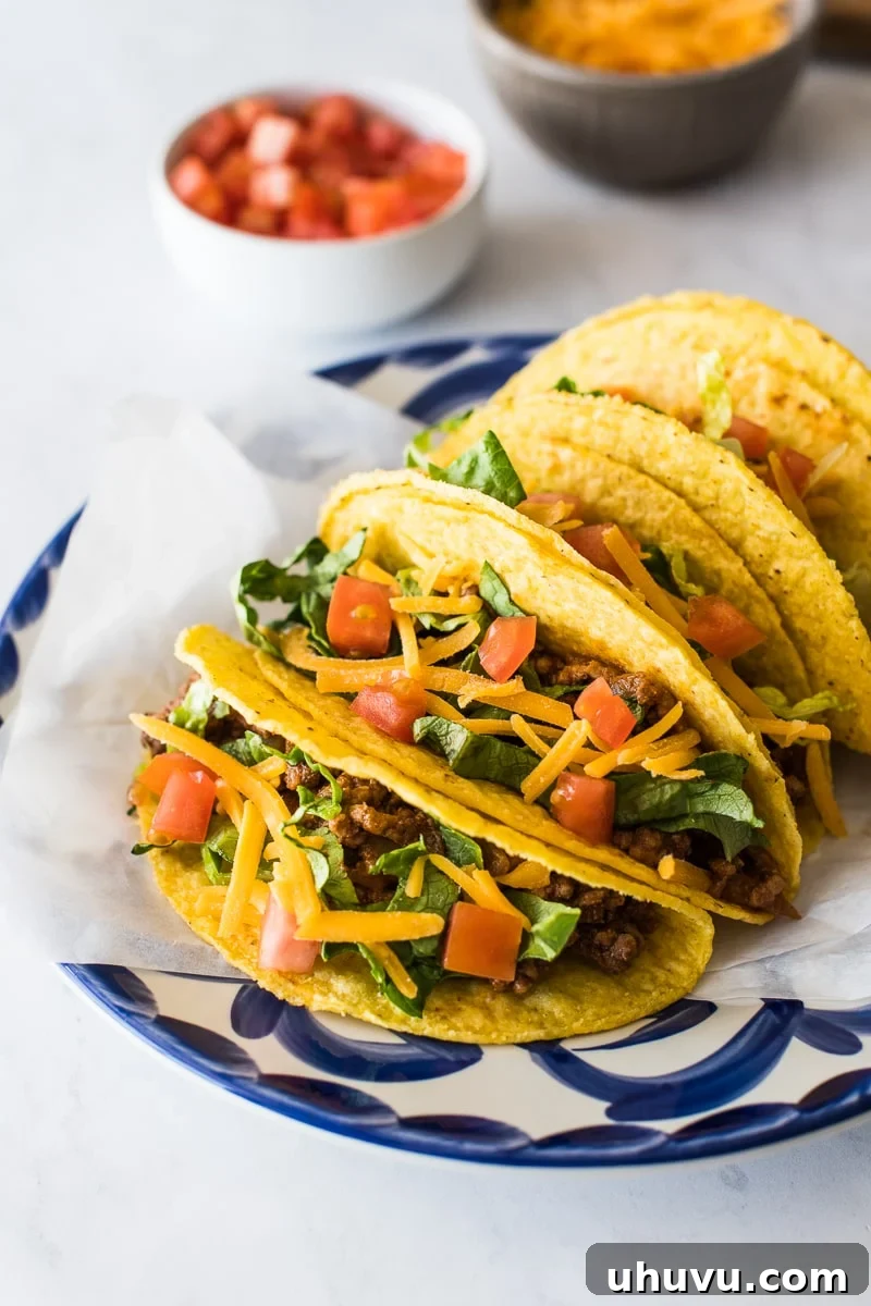 Golden Crispy Tacos 5 Hard shell tacos on a plate ready to be served.