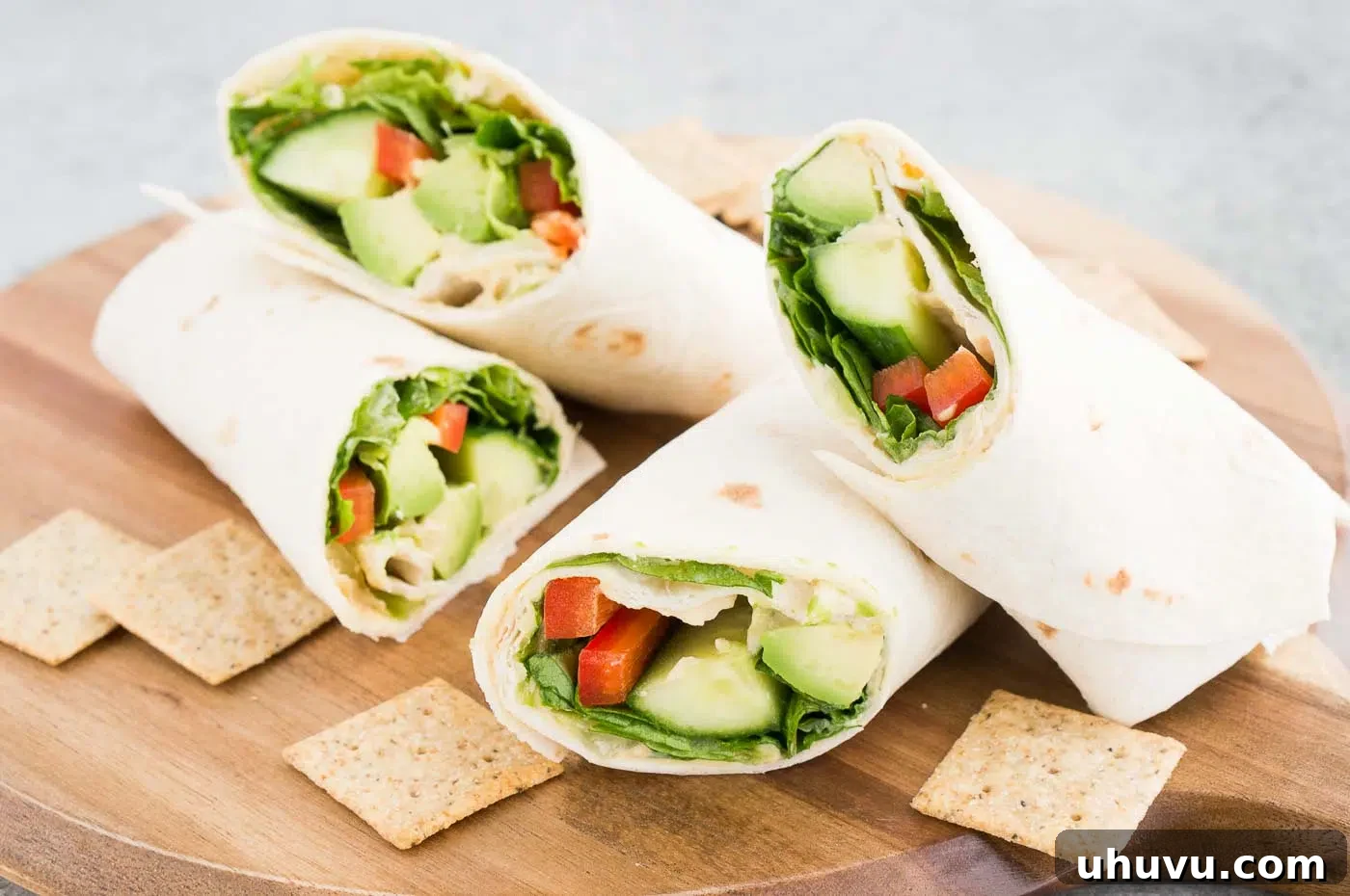 vegetarian wrap and crackers on a board 