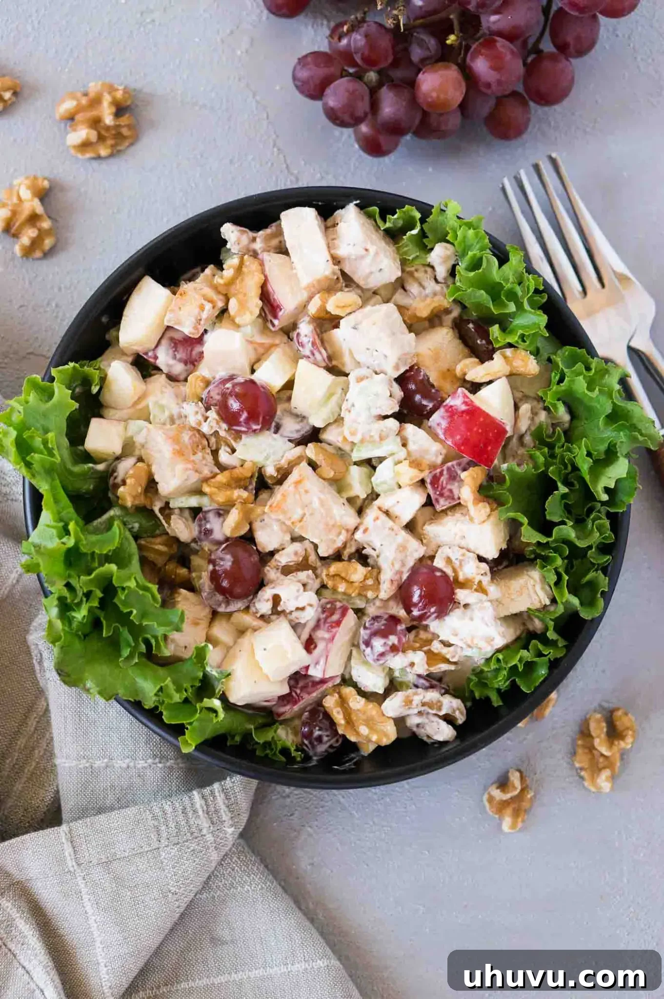 Chicken Waldorf Delight 6 chicken waldorf salad over lettuce in a black bowl