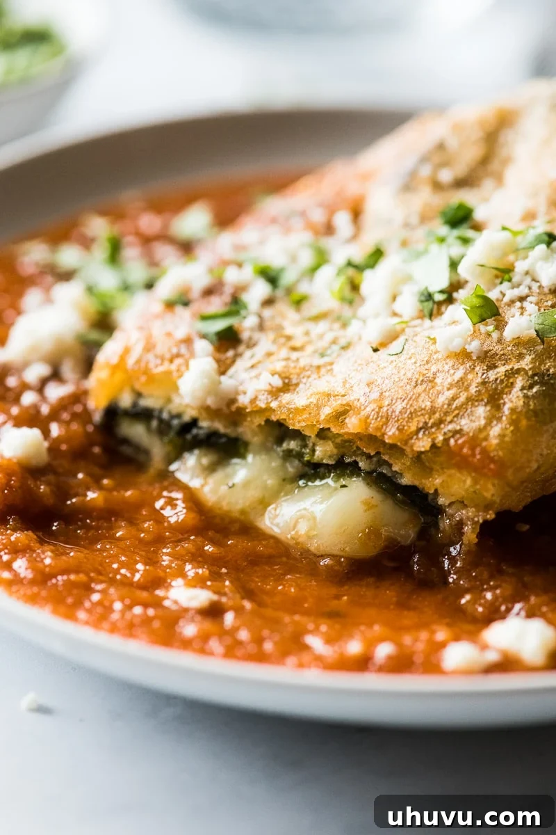 Authentic Chile Relleno from Scratch 7 A freshly fried chile relleno on a plate, with golden batter and tantalizing melted cheese oozing out.