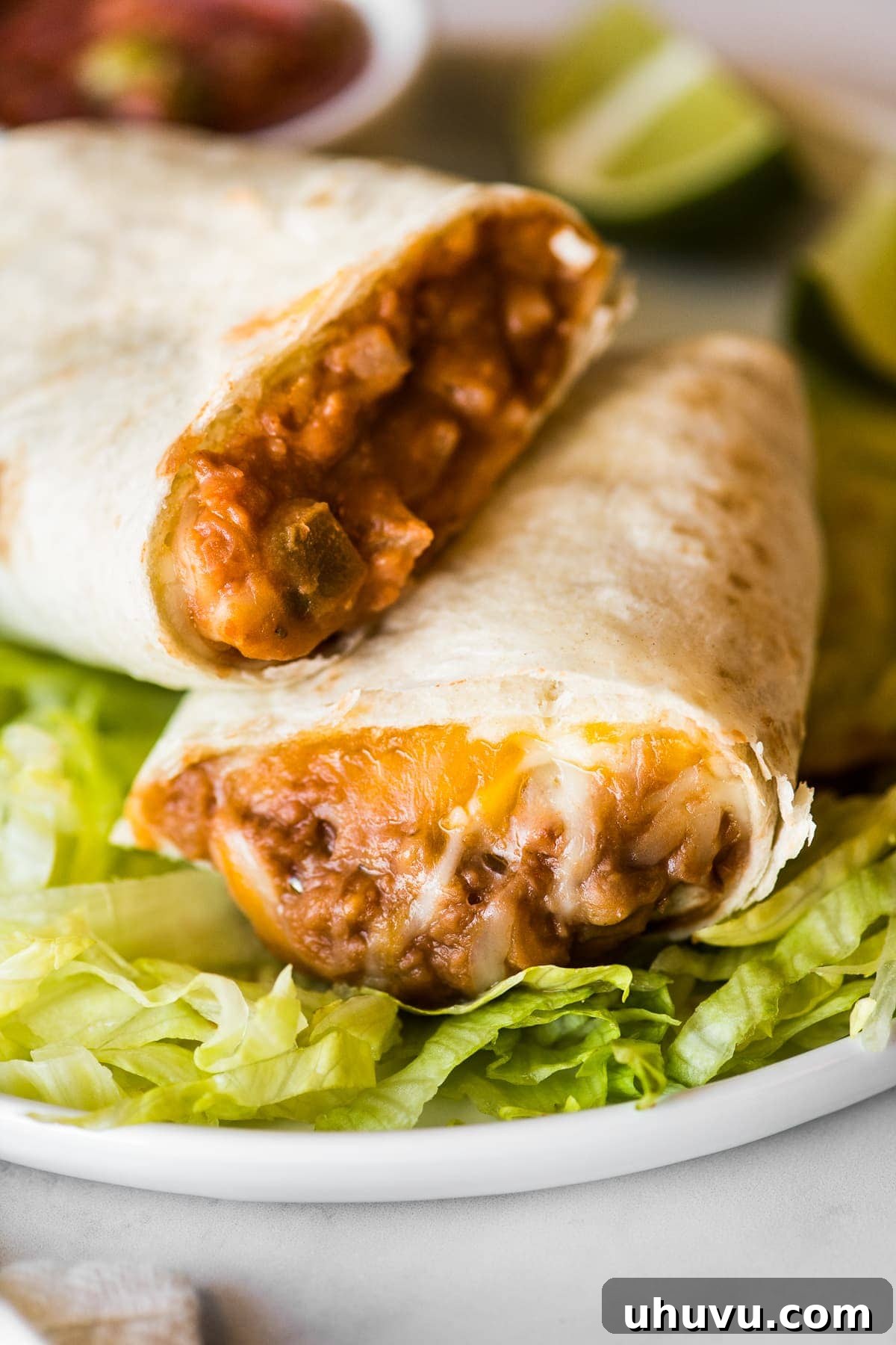 25 Quick Bean Dinners 12 A classic Bean and Cheese Burrito, showcasing melted cheese oozing over creamy refried beans.