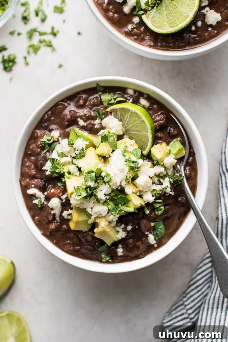 25 Quick Bean Dinners 21 A steaming bowl of Easy Black Bean Soup, rich and comforting.