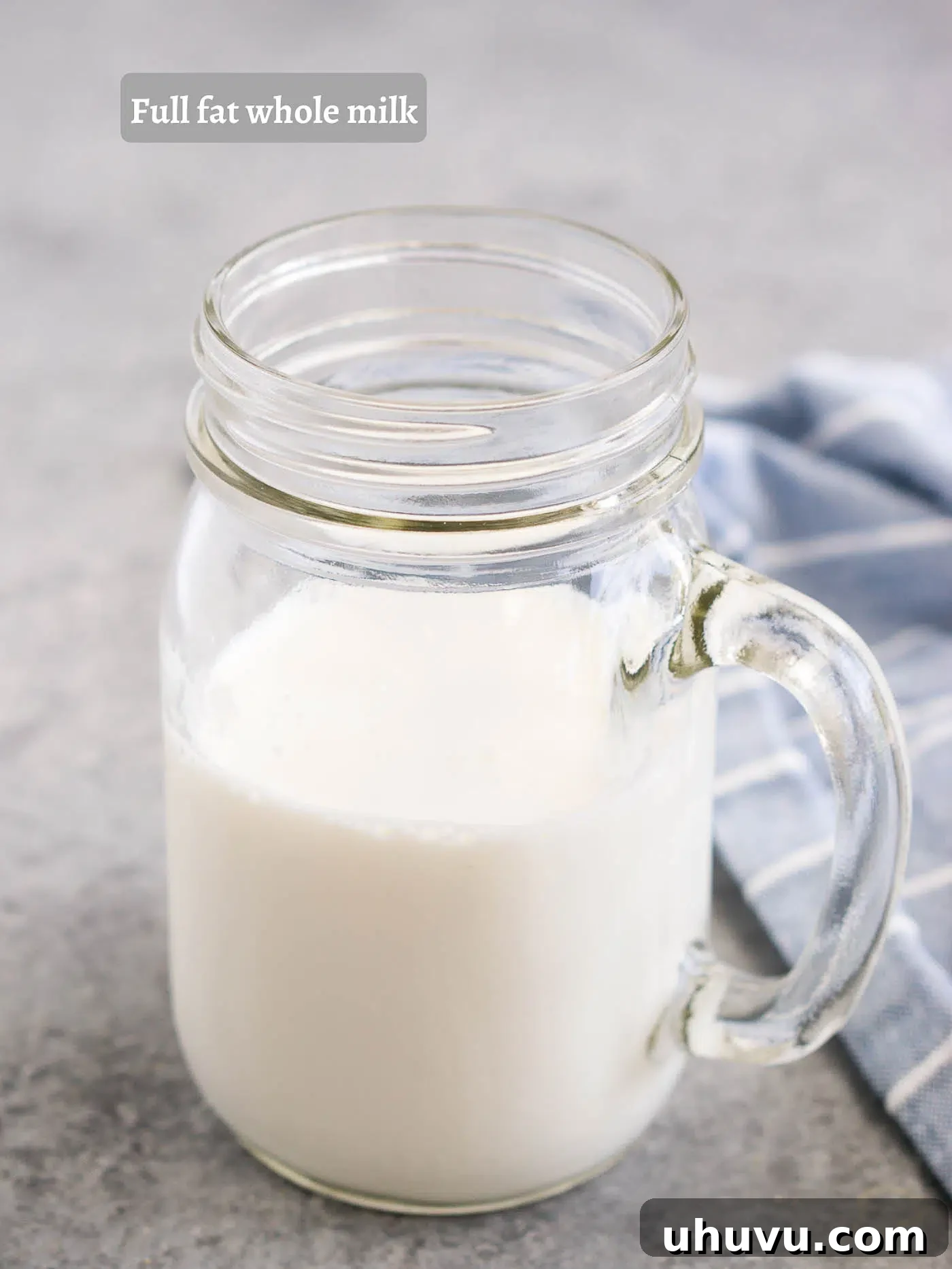 Whole milk in a mason jar, ready for frothing
