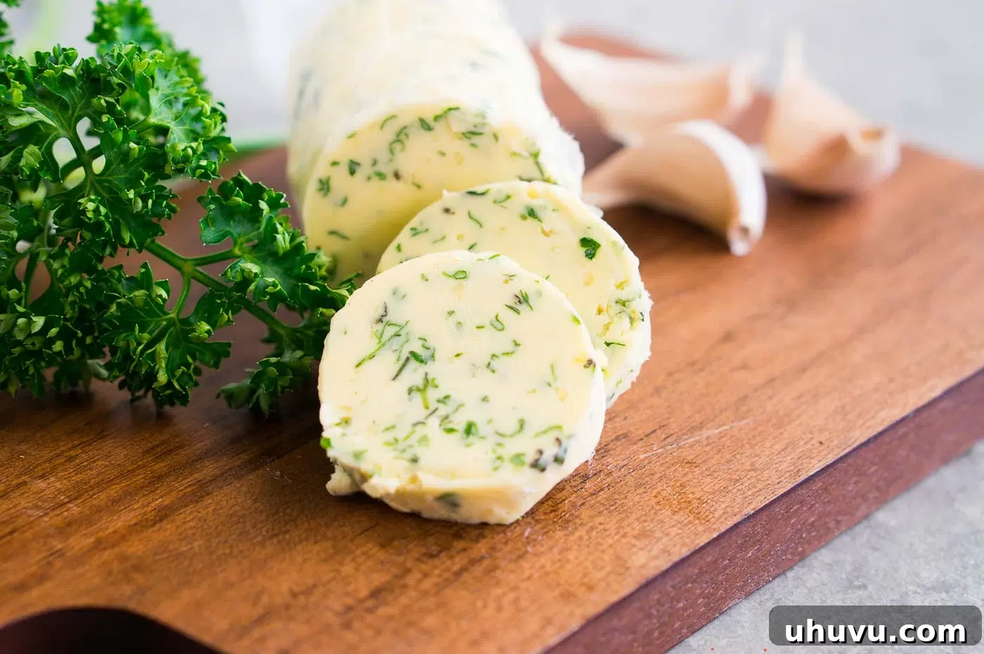Garlic herb butter log wrapped in parchment paper