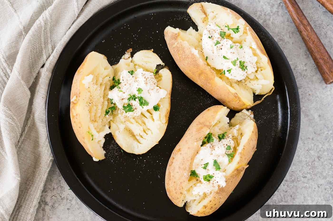 Speedy Instant Pot Baked Potatoes 3 Instant Pot baked potatoes topped with sour cream and fresh chives