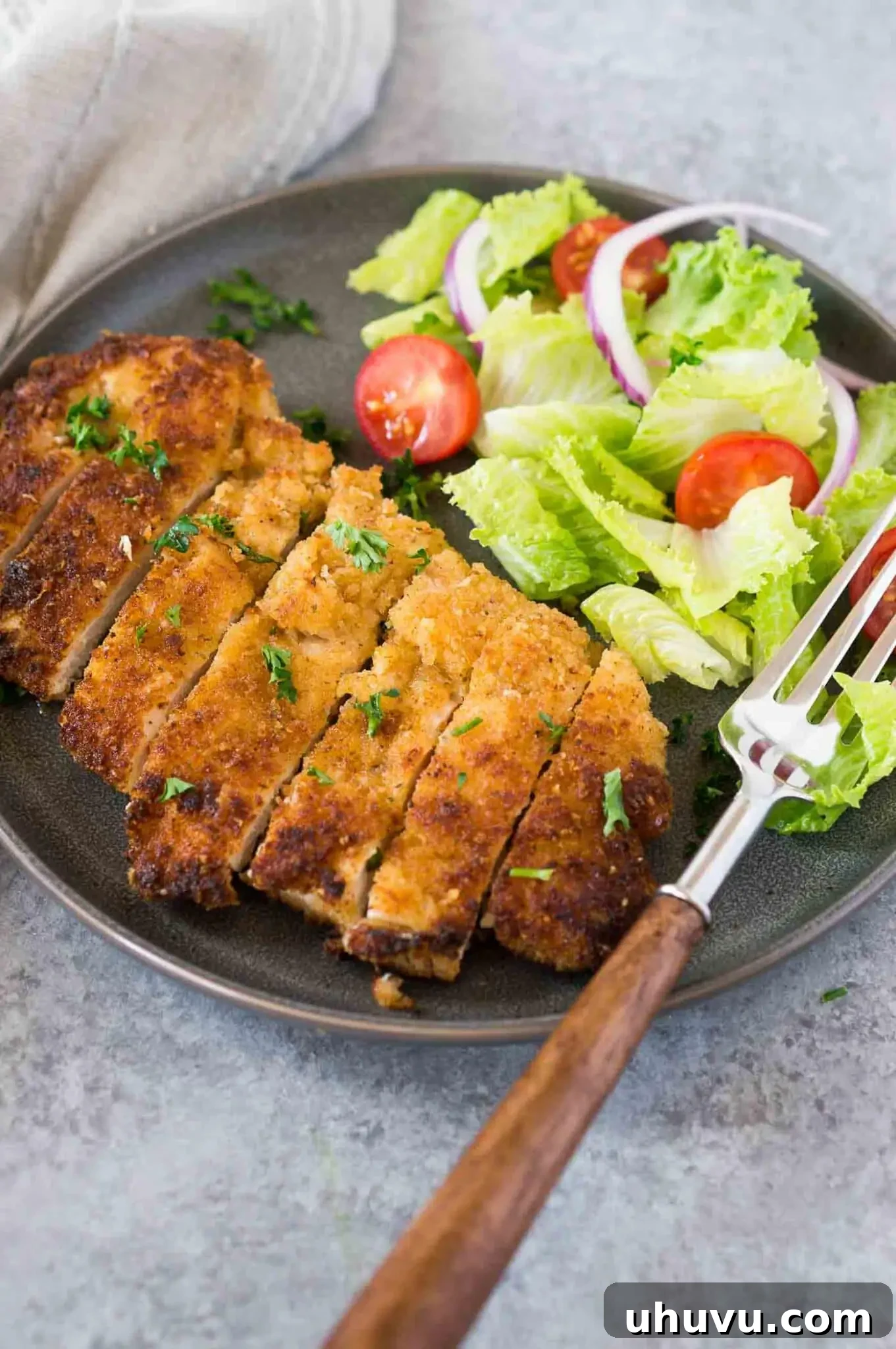 chicken milanese and a salad on a plate