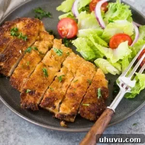 chicken milanese and a salad on a plate
