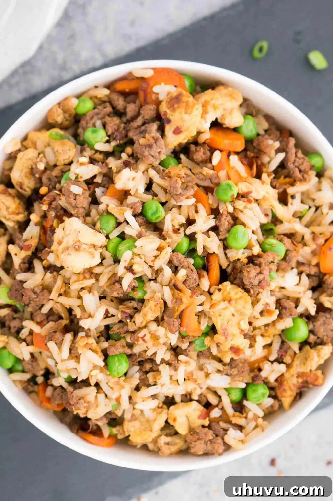 Wok-Fired Beef Rice 11 Healthy fried rice recipe with ground beef and colorful vegetables in a wok