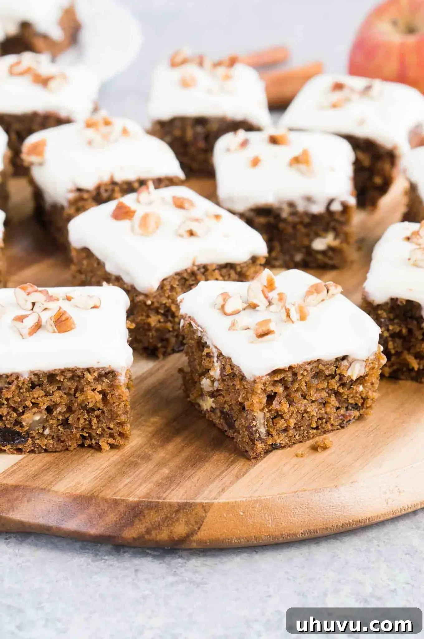 Beautifully cut slices of applesauce cake bars, showing the moist interior and frosting.