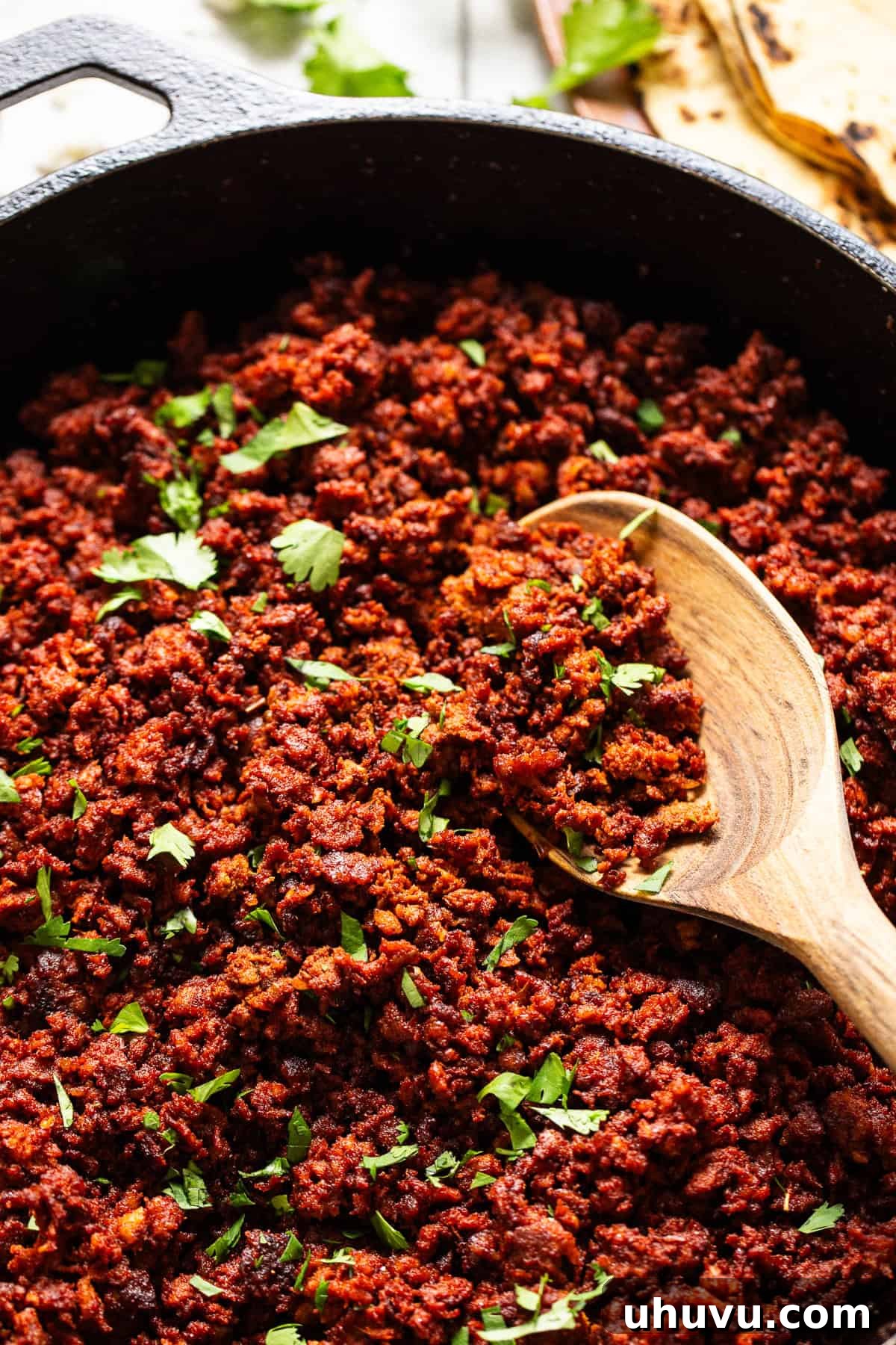 Mexican chorizo recipe in a skillet ready to eat, garnished with cilantro.