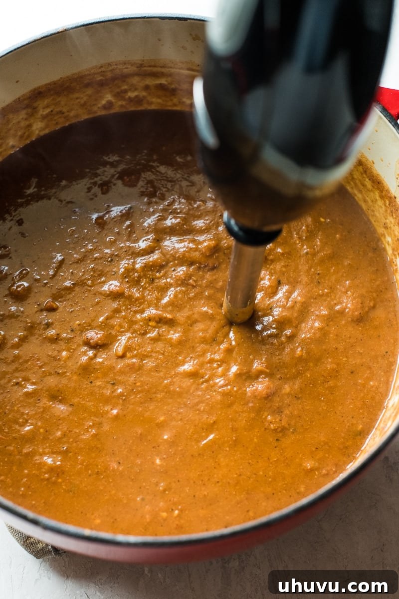 Quick Comfort Pinto Bean Soup 6 An immersion blender in a pot of pinto bean soup