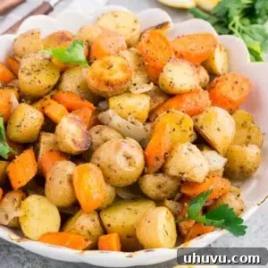 Golden Roasted Potatoes and Carrots 9 roasted potatoes and carrots and caramelized onions in a serving bowl