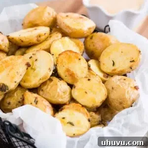 Roasted baby potatoes presented in a rustic basket.