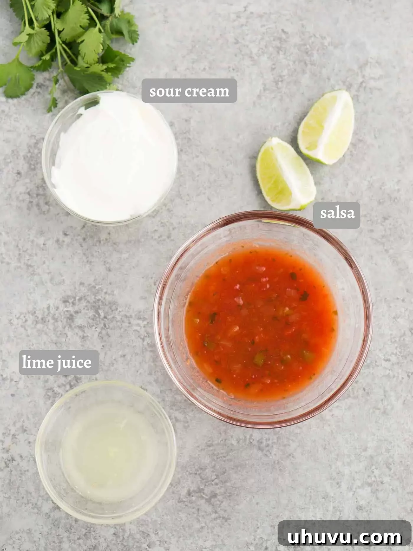 Close-up of the creamy dressing for taco bowls in a small white bowl.