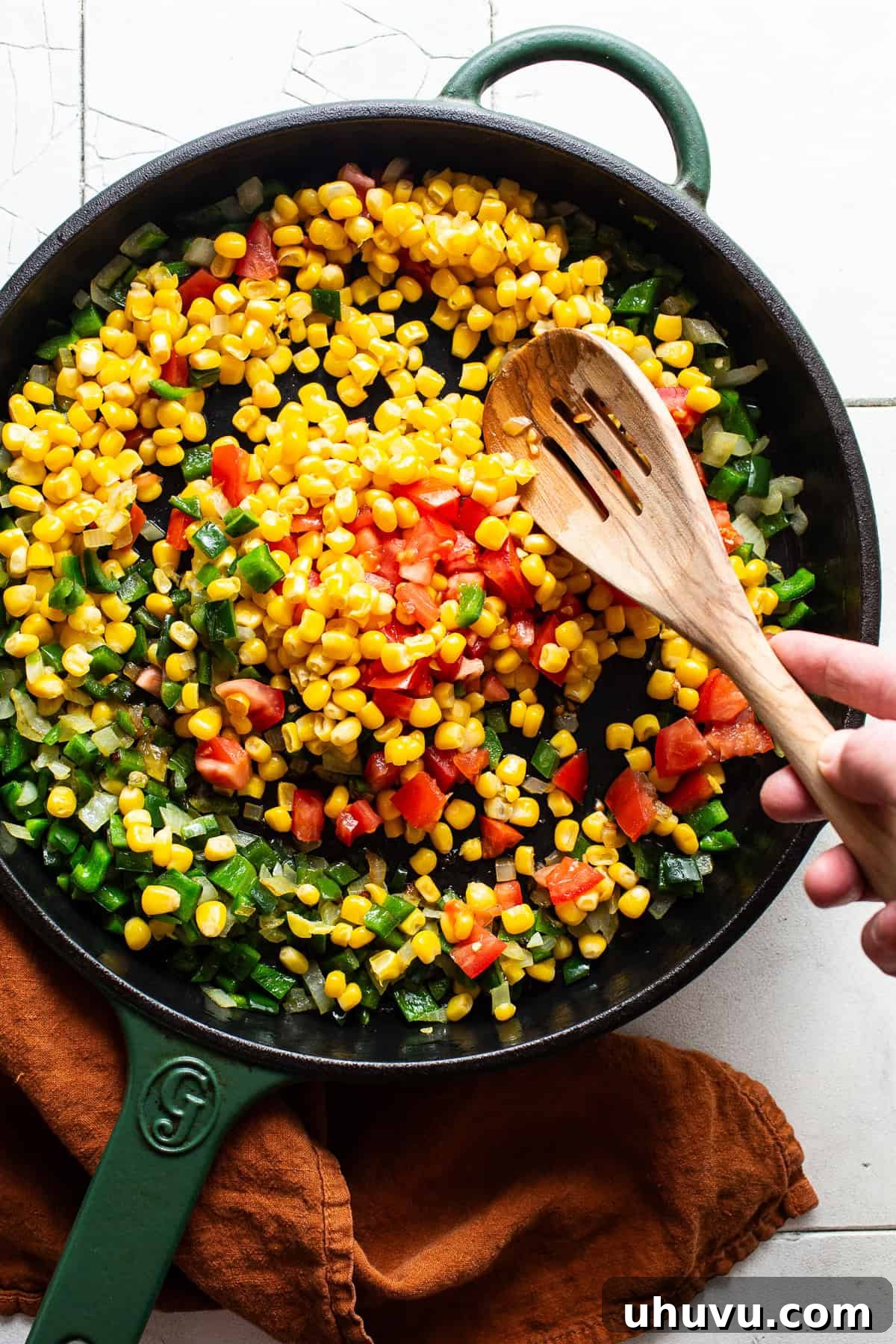 Garden Squash Medley 4 Corn, tomatoes, and peppers cooking in a skillet.