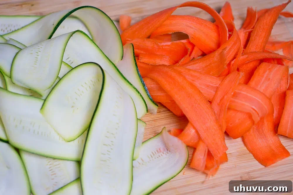 Mixing bowl with shaved vegetables before dressing