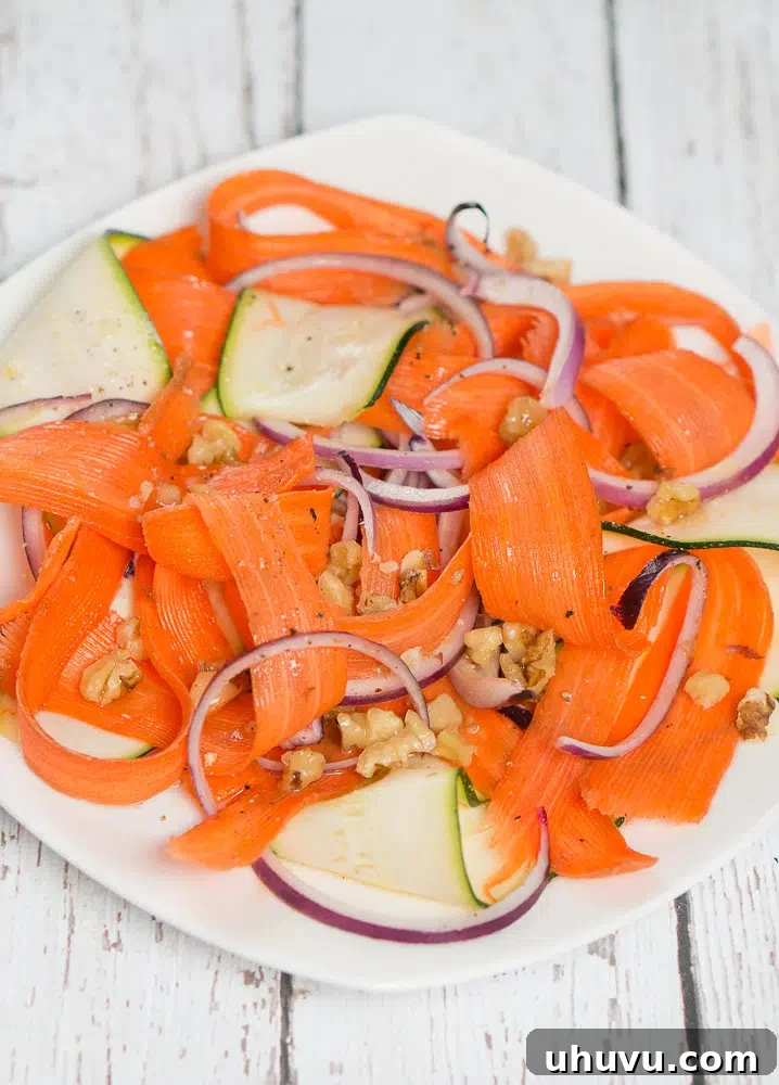 A bowl of Shaved Carrot and Zucchini Salad ready to be served