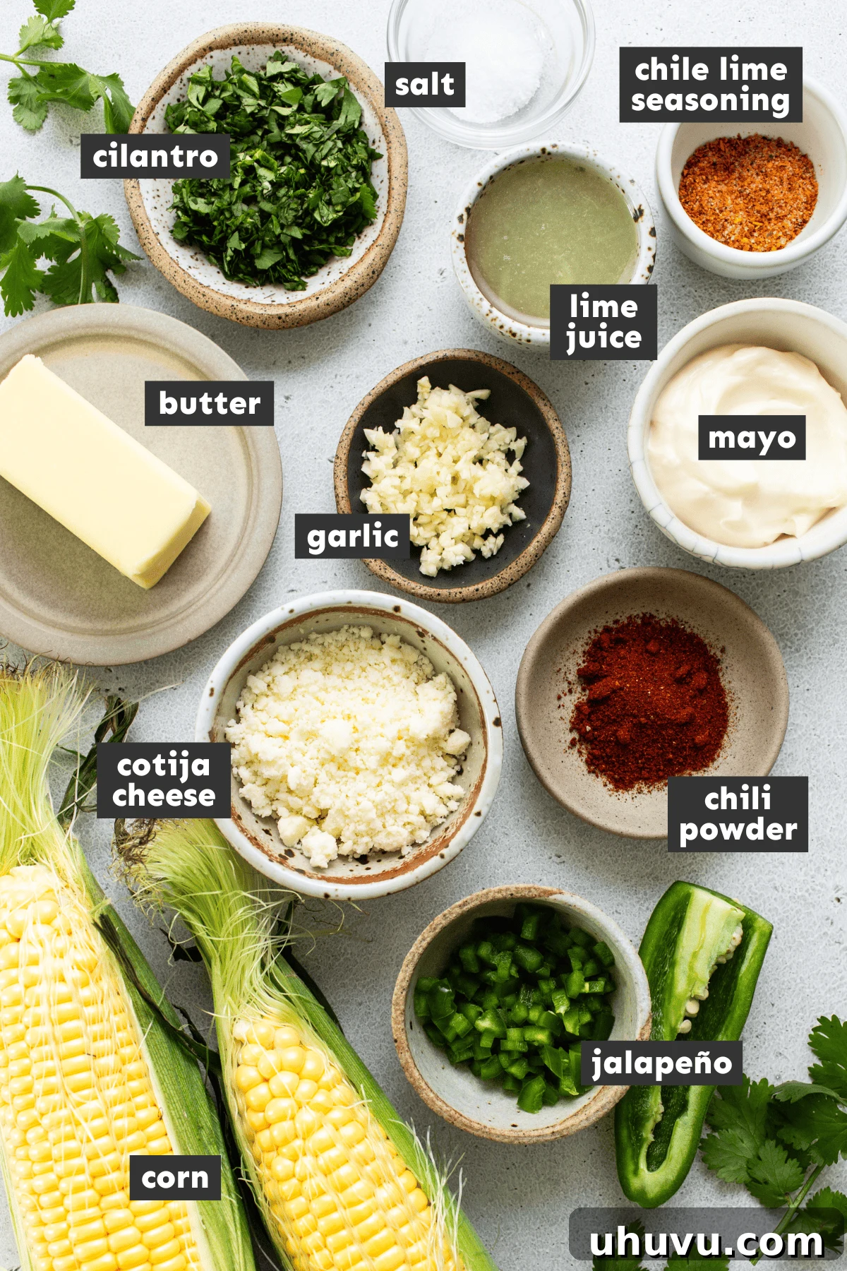 Esquites ingredients all measured out into small bowls, ready for mixing
